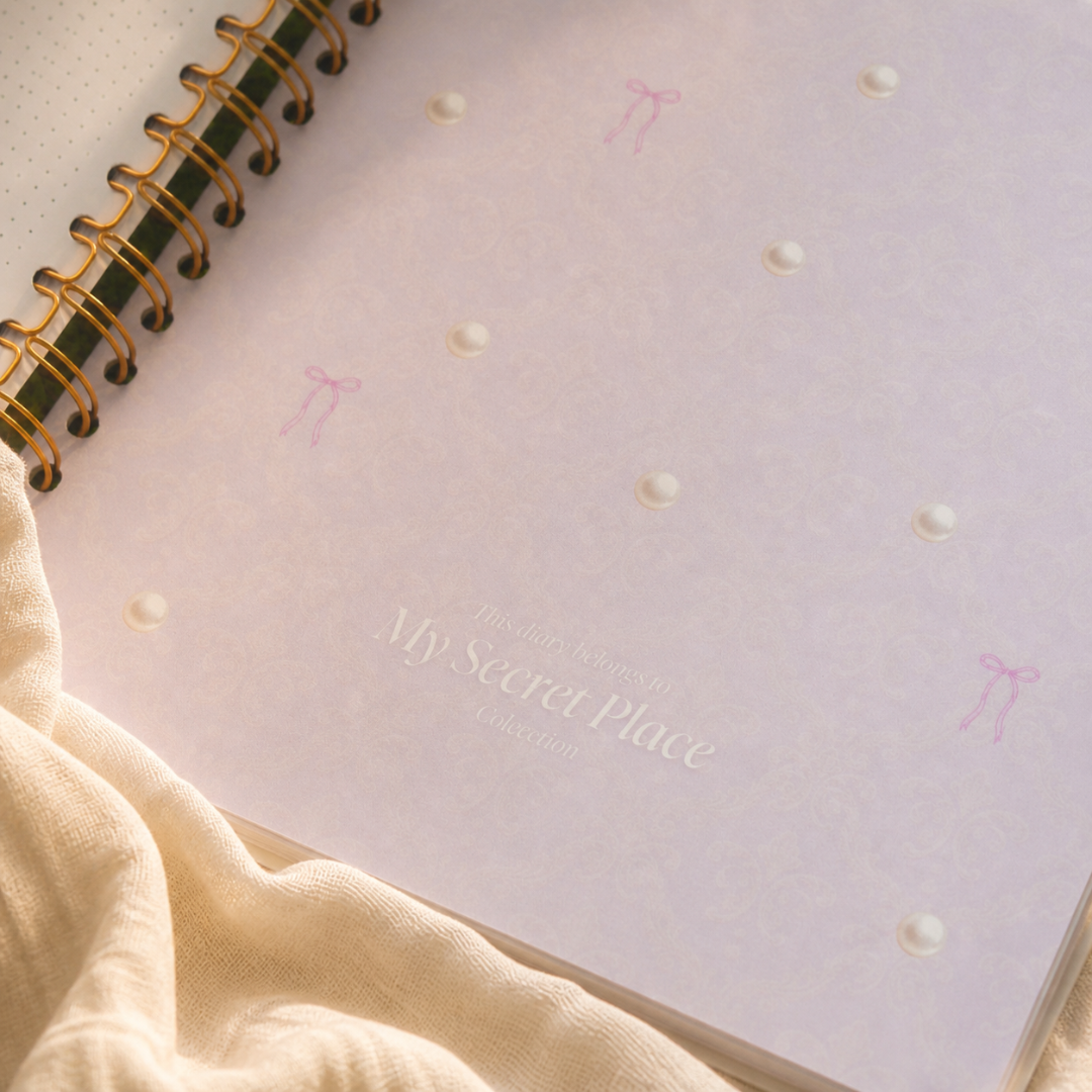 Lavender inside cover and gold spiral binding of My Magic Diary
