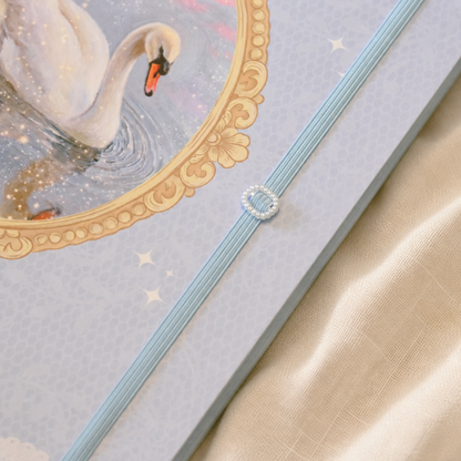 Close-up of the swan cover and blue elastic closure on My Dreamy Diary
